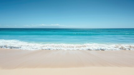 Gentle waves lap against an endless white sandy beach as the serene sea stretches towards the horizon, offering a perfect escape into nature's beauty