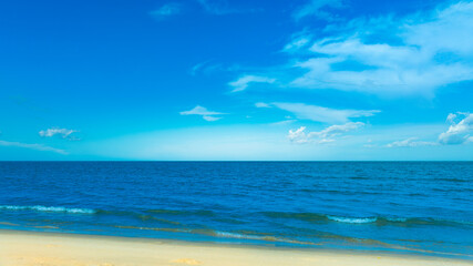Nature of the beach and sea Summer with sunshine, sandy beaches, clear blue waters sparkling against the blue sky. On an island with good ecology and environment Background for summer vacation concept