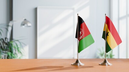 FLAGS OF AFGHANISTAN AND GHANA ON TABLE