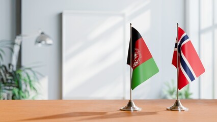 FLAGS OF AFGHANISTAN AND NORWAY ON TABLE