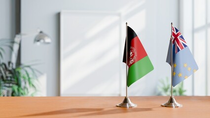 FLAGS OF AFGHANISTAN AND TUVALU ON TABLE