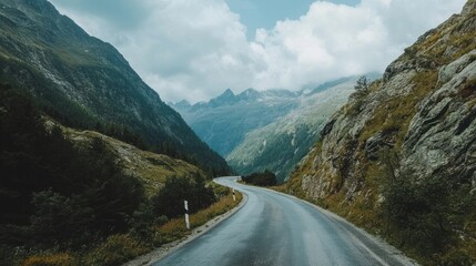Winding Road Through Majestic Mountains