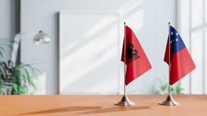 FLAGS OF ALBANIA AND SAMOA ON TABLE