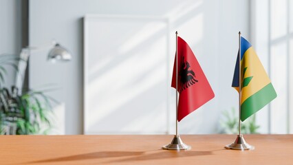 FLAGS OF ALBANIA AND SAINT VINCENT ON TABLE