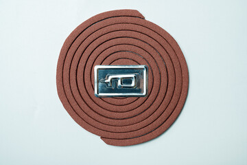 Mosquito coils with a silver lettering on it