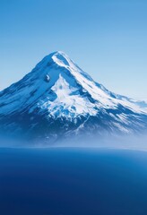 Snow-capped mountain peak by the sea
