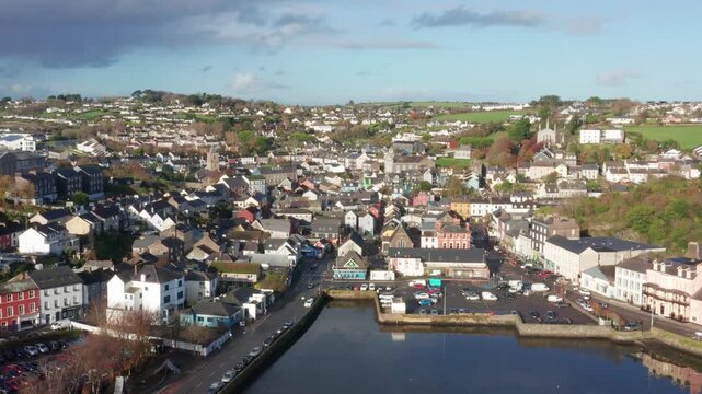 A cinematic aerial revealing the quaint town of Kinsale, Ireland showcasing it's harbour and the River Brandon