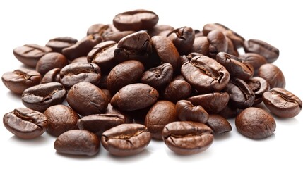Naklejka premium A pile of roasted coffee beans isolated on a white background, displaying varying shades of brown and characteristic textured surfaces.