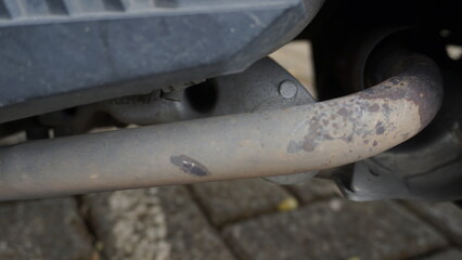 The condition of motorcycle exhaust that corrodes due to exposure to water and hot temperatures
