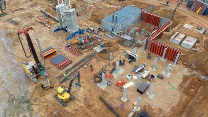 Drone photography of construction drill at construction site during summer cloudy day.