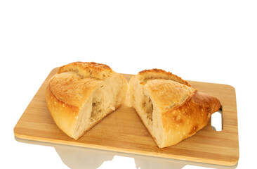Two halves of white bread on a wooden kitchen board, macro, isolated on white background.