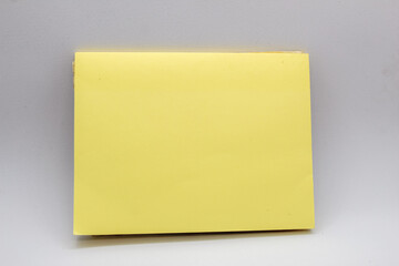 selective focus isolated on white, mockup or template of yellow post it or sticky notes or notepad or blank note
