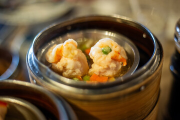 Dim sum shrimp steamed dessert food or breakfast in bamboo containers.