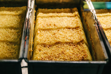 Selective focus, a typical Indonesian bika ambon cake that is fresh from the oven, still in the pan