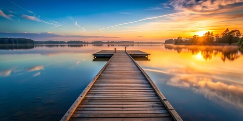 Obraz premium Serene wooden pier jutting out onto calm lake during dawn , wooden, pier, dock, tranquil, lake, calm, water, sunrise