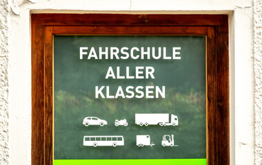 Fototapeta premium German driving school with advertising for all vehicle classes