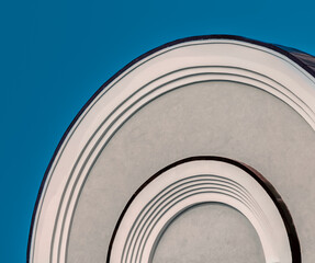 part of a vintage building with curved lines