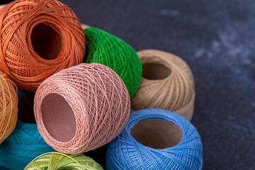 Multicolor yarn for knitting, knitting needles and scissors. Home storage concept and hobby.Raffia is an organic, ecological, wood fiber that is easy to crochet.