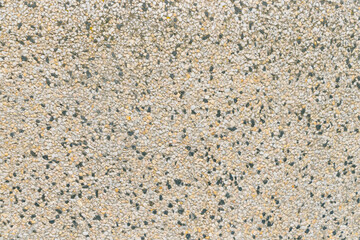 Surface decorated with small pebbles. Backgrounds