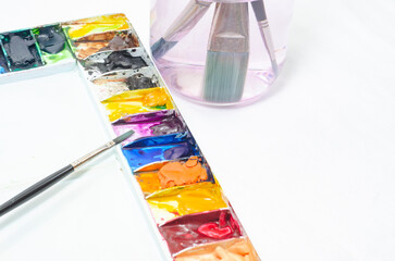 An artist using a watercolor brush