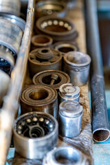 Closeup photo shoot of different nesessary tools and parts in every man's garage.Auto check up and car service shop concept.Different type of tools, especially wrenches.