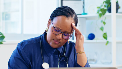 Stressed Doctor in Office with Glasses and Stethoscope Feeling Headache from Overwork and Fatigue