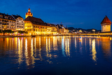 Lucern city with famous Chapel Bridge. Lucerne city view. Canton of Lucerne. Lucern Switzerland. Sunrise in historic city center of Lucerne with famous Chapel Bridge and lake Lucerne.