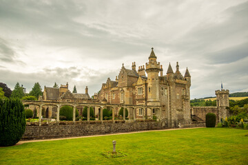 romantic castle house and garden with lawn and sky shot in abbotsford in the scottish borders room for text