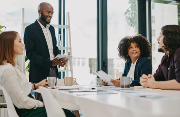 Business people, team and presentation discussion in office with ideas for budget report or company profit. Finance collaboration, employees or documents with feedback in boardroom for sales strategy