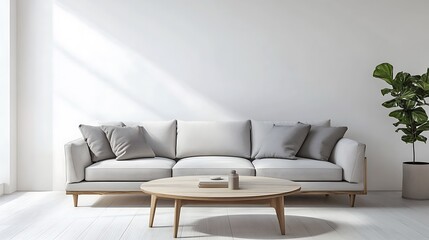 A minimalist living room with white walls, a gray sofa, and a simple wooden coffee table.