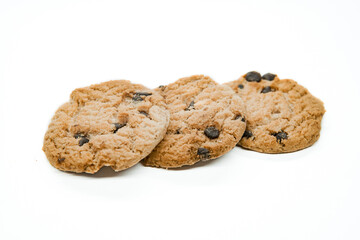 Isolated clipping path of dark chocolate chip cookie on white background. Biscuits with chocolate topping. Cookies isolated on white background