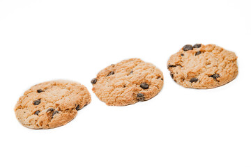 Isolated clipping path of dark chocolate chip cookie on white background. Biscuits with chocolate topping. Cookies isolated on white background