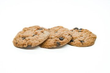 Isolated clipping path of dark chocolate chip cookie on white background. Biscuits with chocolate topping. Cookies isolated on white background