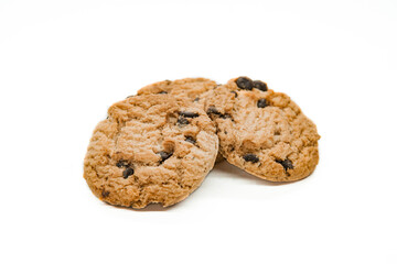 Isolated clipping path of dark chocolate chip cookie on white background. Biscuits with chocolate topping. Cookies isolated on white background