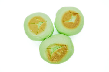 Round green bread isolated on white background