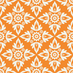 Fototapeta premium colorful ethnic motif seamless pattern for wallpaper and textile on orange background.