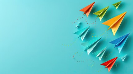 A blue background with a bunch of colorful paper airplanes flying in the air