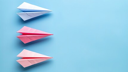 Three paper airplanes are on a blue background
