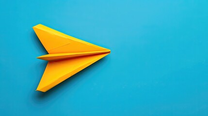 A yellow paper airplane is on a blue background