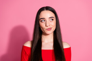 Photo of nice young girl look empty space think red top isolated on pink color background