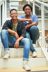 Smile, stairs and portrait of black couple in home for new mortgage, purchase or real estate investment. Happy, love and African man and woman on steps of rental apartment for moving together.