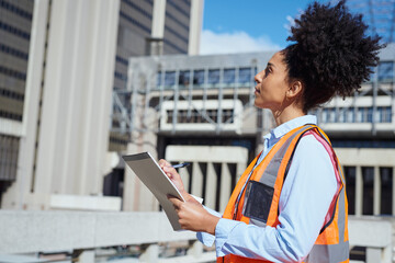 Female Construction Worker Inspecting Building Site with Clipboard