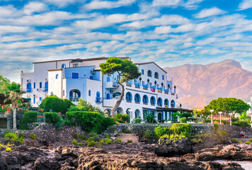 summer beautiful view of nice hotel resort building in greek style on sea coast with amazing...