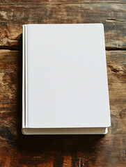  white soft cover book lying on the table, birds eye view