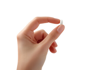 Close-up of a hand holding a single white pill isolated on white background