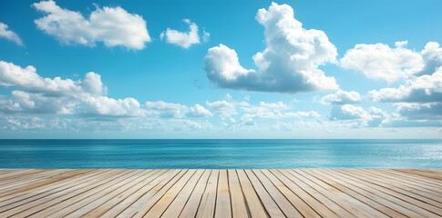 Fototapeta premium Wooden deck in front of clear blue ocean with clouds in the sky