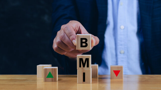 BMI big mac index symbol, Concept words BMI big mac index on wooden cube, Medicine and Body Mass Index concept, Doctor health.