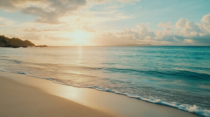 Obraz premium The sunset over a beautiful beach