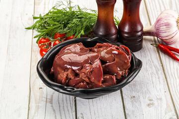 Raw chicken liver uncooked in the bowl