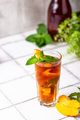 Cold ice tea with peach and mint
